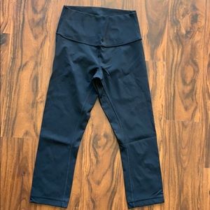 Lululemon WunderUnder black cropped leggings.